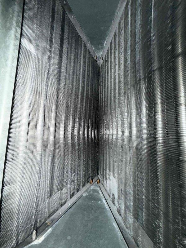 Completed preventive maintenance agreement service on dual condenser system. Inspected and serviced two outdoor condensing units, checked refrigerant levels, cleaned coils, and verified proper operation of both units. Performed interior air handler inspection, examined COMMAND2 control board connections and wiring, verified electrical components functioning properly, inspected ductwork plenum and condensate drainage system for proper operation and cleanliness.