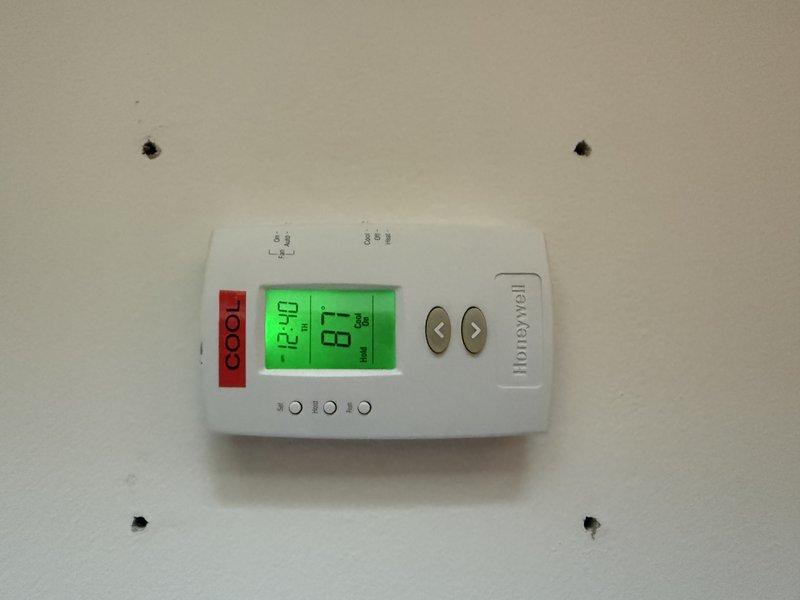 Responded to no-cooling call on Rheem Classic condenser system. Upon arrival, confirmed upstairs thermostat calling for cooling with indoor blower operational but outdoor condenser unit completely non-responsive. Verified customer had already checked disconnect switch, thermostat settings, and electrical breakers prior to service call. Performed diagnostic evaluation of condensing unit including electrical testing and component inspection to identify failure point preventing compressor and condenser fan operation.