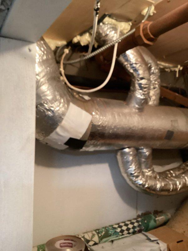Responded to service call for water leakage from indoor air handler and intermittent power issues affecting dual HVAC system. Upon inspection, found 12-year-old Lennox system with clogged condensate drain line causing water overflow in basement. Cleared blockage from drain line, verified proper drainage flow, and tested condensate pump operation. Inspected outdoor condenser units positioned in exterior enclosure, confirmed both units operational with adequate airflow despite debris accumulation around equipment. Cleaned area around outdoor units and verified electrical connections secure at both indoor and outdoor equipment. Advised customer that intermittent power issues likely result from electrical circuit overload when both systems operate simultaneously during peak cooling demand, recommending evaluation by licensed electrician to assess circuit capacity and potential need for dedicated circuits. System restored to normal operation with proper condensate drainage confirmed.