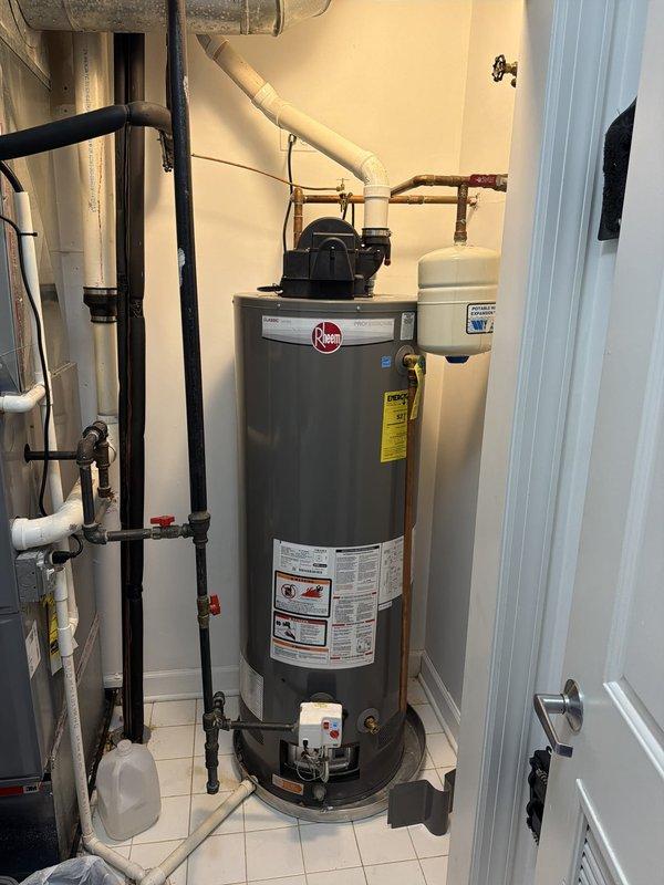 Responded to service call for Rheem tanked water heater with non-functioning pilot light. Upon inspection, diagnosed and resolved pilot light ignition issue, restoring proper operation to the water heating system. Verified hot water delivery temperature at fixture, confirming system returned to normal functionality with temperature reading of 93.3°F at tap.