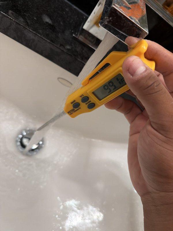 Responded to service call for Rheem tanked water heater with non-functioning pilot light. Upon inspection, diagnosed and resolved pilot light ignition issue, restoring proper operation to the water heating system. Verified hot water delivery temperature at fixture, confirming system returned to normal functionality with temperature reading of 93.3°F at tap.