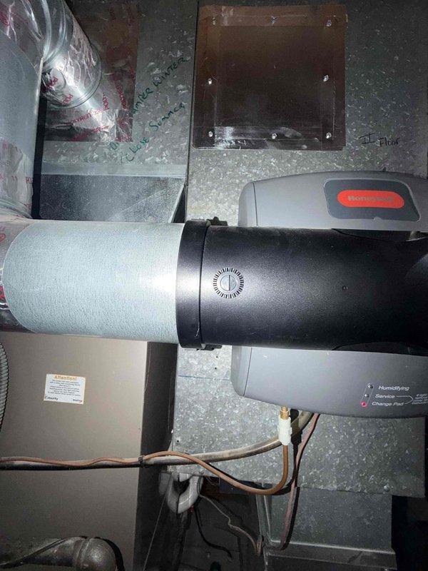 Completed comprehensive maintenance agreement service on two air conditioning systems. Inspected and documented humidifier installation including electrical connections, wiring harnesses, and ductwork integration. All components photographed and verified operational, with electrical connections and control mechanisms confirmed secure and functioning properly.