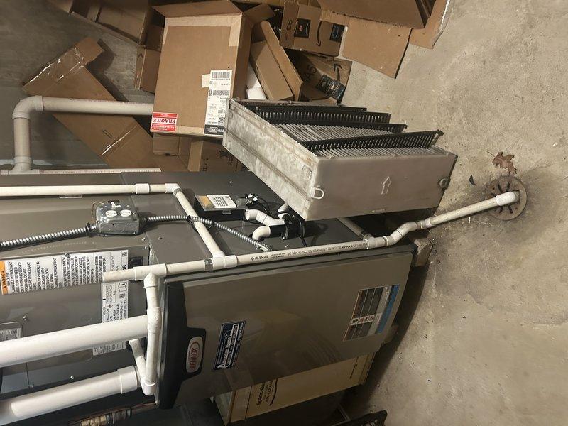 Completed full air conditioning system installation including replacement of outdoor condensing unit, indoor evaporator coil, and thermostat. All components were properly staged, installed per manufacturer specifications, and tested for optimal performance. System refrigerant lines were connected with proper insulation, condensate drainage was verified, and electrical connections were secured to ensure safe and efficient operation.