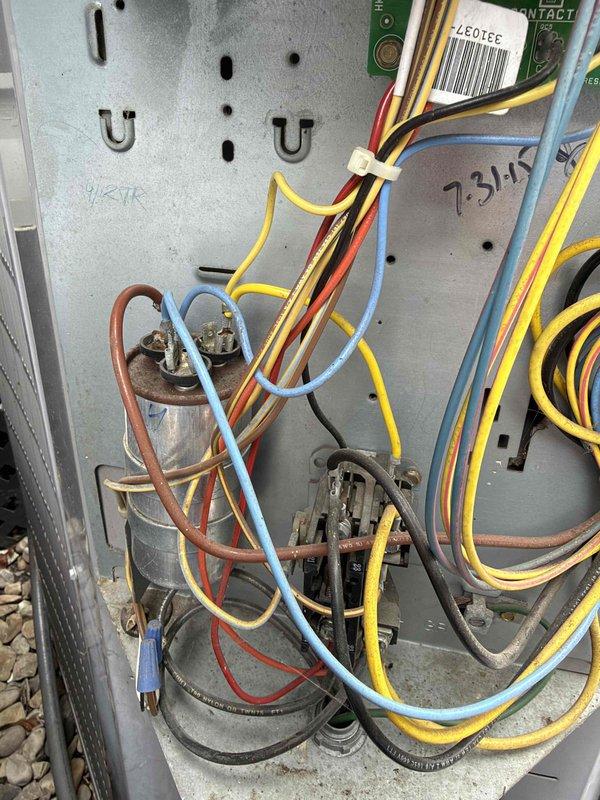 Responded to service call for low voltage electrical issues on dual Carrier air conditioning units. Upon inspection, discovered deteriorated wiring connections and aging control board components within the electrical panel. Performed comprehensive low voltage repairs including replacement of damaged wire segments, re-secured loose connections with new zip ties, and tested all control circuits for proper voltage and continuity. Verified both condensing units were receiving proper 24V control signals from thermostat. All systems tested and operational upon completion.