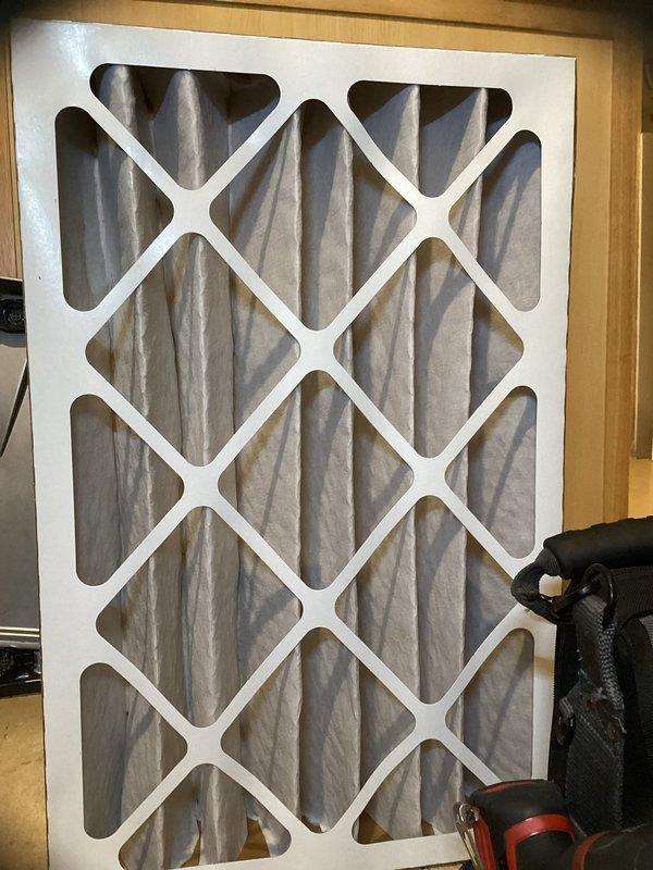 Completed preventative maintenance agreement service on HVAC system including two Carrier condensing units and air filtration system. Performed comprehensive cleaning and inspection of both outdoor condenser units, model ZPVP30621A1AAAAA utilizing R-410A refrigerant. Inspected 16x25x4 pleated air filter showing moderate dust accumulation; customer notified that filter replacement is not included in agreement service. All equipment operating within normal parameters, manufacturer labels and safety warnings verified intact and legible. System documentation photographed for service records.