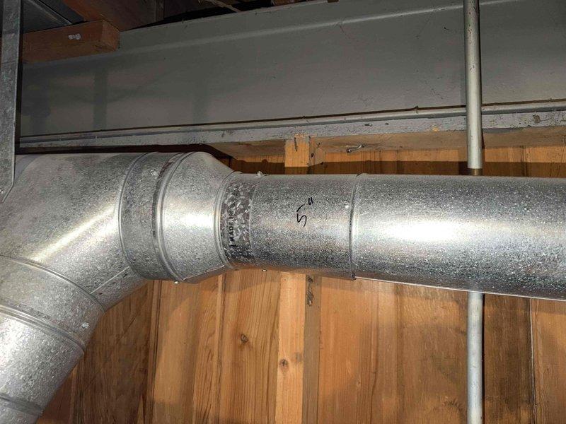 Responded to service call for leaking water heater on AO Smith tanked unit originally installed in 2013. Upon inspection, identified active leak requiring attention and documented existing plumbing configuration including copper supply lines, gas connections with braided flex lines, and metal flue venting system. Photographed installation showing multiple water heater setup with proper venting through galvanized ductwork and assessed overall system condition for repair recommendations.