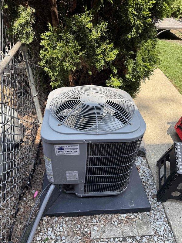 Completed cooling system maintenance agreement inspection on residential Carrier air conditioning unit. Performed comprehensive system evaluation including temperature diagnostics, measuring 74.4°F at indoor equipment location, verified proper refrigerant operation, and documented outdoor condenser unit condition with all components functioning within normal parameters.