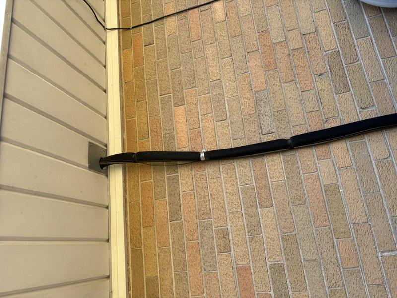Provided comprehensive estimate for complete air conditioning system replacement. Assessed existing outdoor condenser unit positioned on concrete pad against exterior brick wall, documenting current equipment condition and installation configuration. Presented customer with replacement options and specifications for new HVAC system installation.