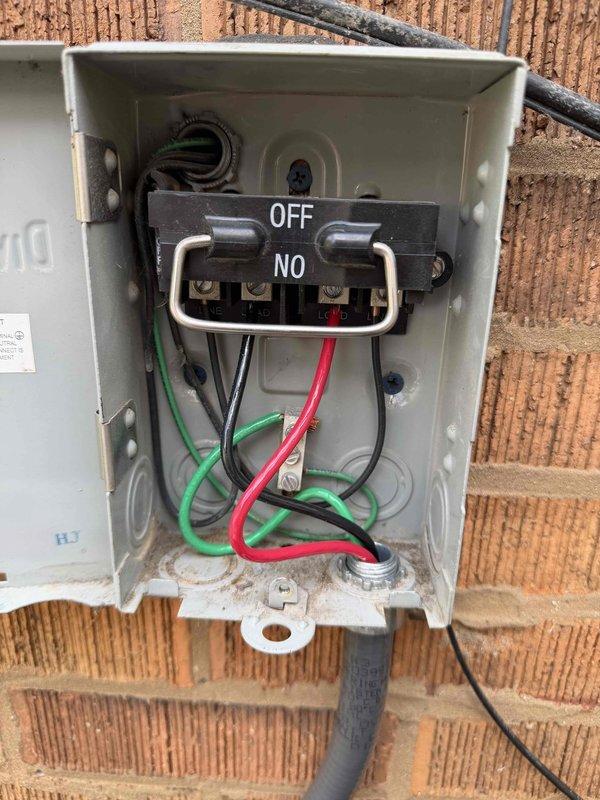 Responded to service call for 10-year-old mini split system with no power condition. Upon arrival, inspected outdoor condensing unit and electrical components mounted on exterior brick wall. Found electrical disconnect switch in OFF position. Verified proper wiring connections at disconnect box, confirmed all conductors were secure and properly terminated. Reset disconnect switch to ON position and restored power to system. Tested unit operation and confirmed condenser fan motor engaged properly and system powered on successfully. Verified electrical connections at outdoor unit were tight and secure. System returned to normal operation with no further issues observed.