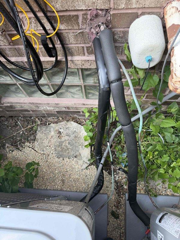 Completed replacement of first-floor air conditioning system and evaporator coil. Installed new indoor coil assembly above existing furnace with proper plenum connections and secured all refrigerant line sets along exterior brick wall to outdoor condensing unit. Verified all electrical connections, tested system operation, and confirmed proper airflow through ductwork.