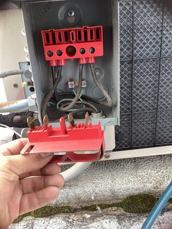 Completed routine air conditioning maintenance inspection per agreement terms. Accessed and inspected blower assembly, confirming squirrel cage fan wheel in clean operational condition with minimal debris accumulation on blades and proper motor shaft alignment. Performed electrical safety procedures at outdoor disconnect box, utilizing lockout/tagout device to ensure technician safety during service. Inspected electrical connections and terminal blocks, verifying secure wire terminations and proper circuit integrity. Documented equipment condition through photography for service records. Unit operating within normal parameters upon completion of maintenance visit.