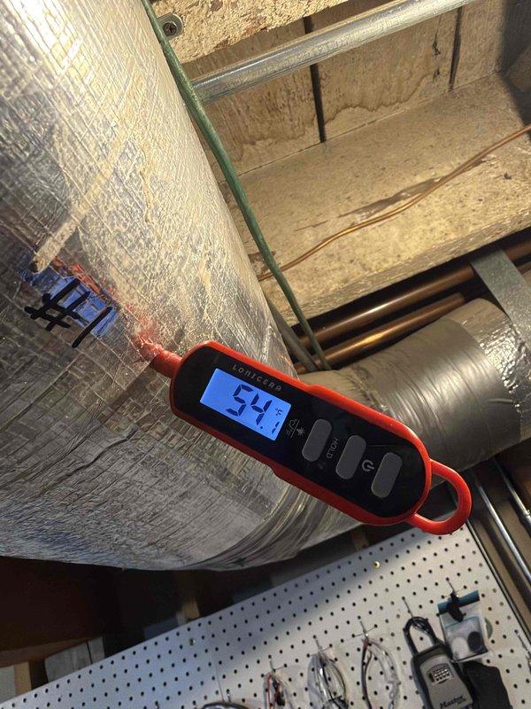 Performed courtesy check on three air conditioning units and one air handler. Inspected blower motor assembly and verified proper wiring connections and motor operation. Measured and documented supply air temperature at 54.9°F, confirming adequate cooling performance. Captured documentation of equipment condition for service records.