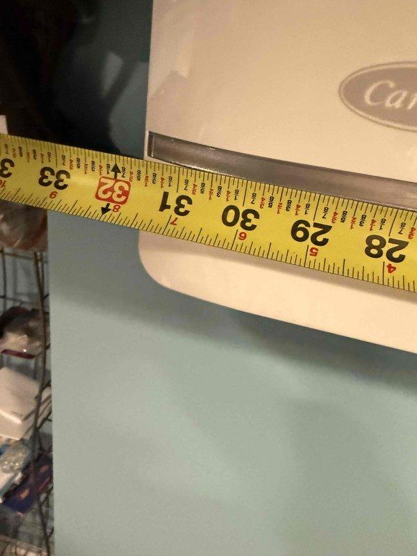 Completed estimate for mini split system replacement. System found with no refrigerant charge and insufficient electrical line length requiring correction. Documented existing wall-mounted indoor unit installation and measured clearances for proper equipment sizing and replacement planning.