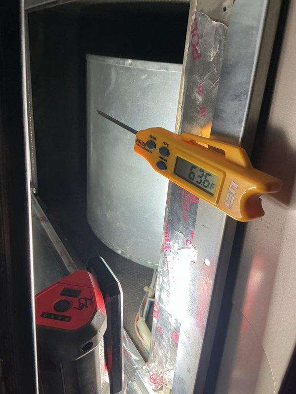 Completed routine maintenance on residential air conditioning system. Inspected outdoor condenser unit, noting vegetation accumulation around base and white residue on exterior panels; cleared debris and verified proper airflow through coil fins. Measured system temperatures at indoor air handler, confirming proper operating temperatures at 83.8°F. Unit operating within normal parameters with no mechanical issues identified.