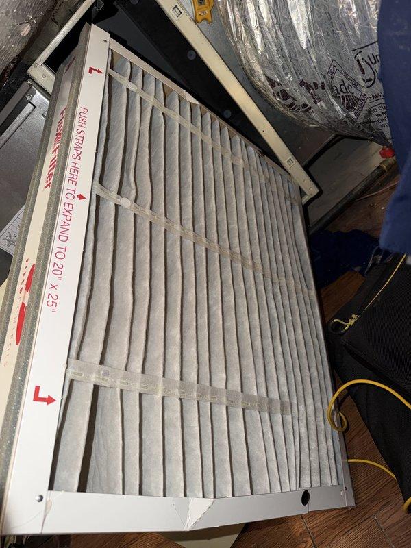 Responded to no cooling complaint with system blowing warm air. Upon inspection, verified airflow through Aprilaire Model 2200 media air cleaner and checked filter condition, which appeared clean and properly installed with correct airflow direction. Performed diagnostic testing using digital manifold gauges, obtaining pressure readings of 32 PSI on both high and low sides, indicating potential refrigerant system issue requiring further evaluation of compressor operation and refrigerant charge levels.