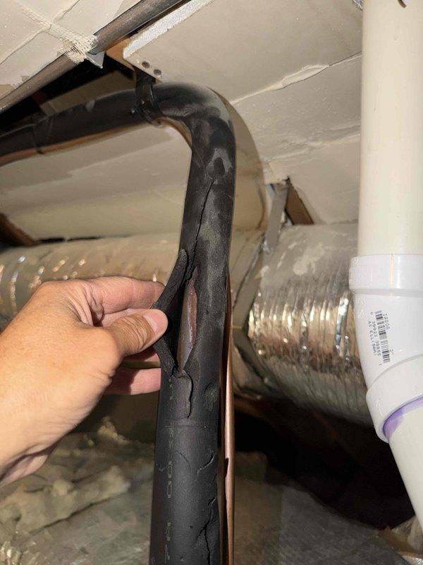 Responded to call back for recently installed air conditioning system reported as non-operational. Upon arrival, performed comprehensive system inspection including attic-mounted ductwork and refrigerant line installations. Inspected foam pipe insulation on refrigerant lines, noting deterioration and potential gaps in coverage that could affect system efficiency. Examined flexible ductwork connections and verified proper sealing at junction points. Checked PVC condensate drain lines for proper pitch and secure connections. Documented existing conditions with photographs showing ductwork configuration, insulation condition, and plumbing installations. System components appeared properly installed with ductwork securely fastened and insulation materials in place, though some insulation showed signs of wear. Verified all mechanical connections in attic space were accessible and properly supported. Rescheduled follow-up appointment to complete diagnostic testing and address any operational