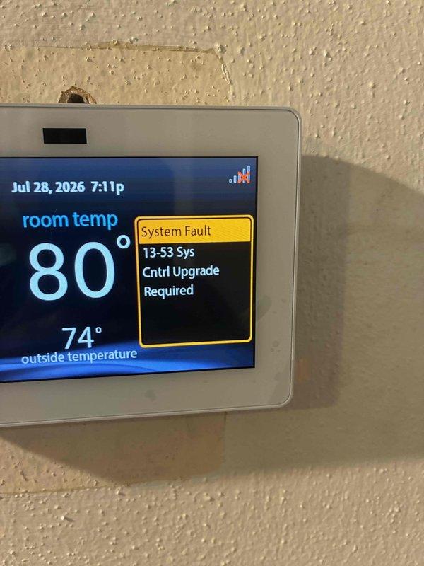 # HVAC System Replacement

Completed full HVAC system replacement including heat pump outdoor unit, air handler, and digital thermostat. New air handler was installed in attic space, properly suspended from structural beams with secure mounting hardware. Unit was connected with appropriate PVC condensate drainage and metallic flex ductwork. Digital programmable thermostat was mounted and configured, displaying system fault code 13-53 indicating control upgrade requirement that will need to be addressed during follow-up service visit.