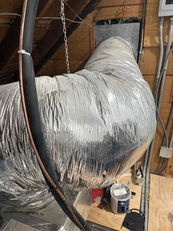 Conducted comprehensive evaluation of existing 30+ year old Space Pak HVAC system for full replacement. Unit located in attic space with favorable accessibility for equipment removal and installation. Assessed existing flexible ductwork, electrical panel configuration, and copper refrigerant line routing. Documented current system layout including metallic flex duct runs, electrical connections, and mechanical infrastructure to develop accurate replacement specifications and installation plan.