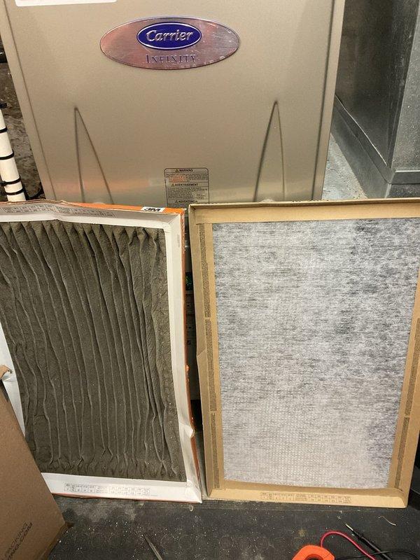 Responded to no cooling complaint on 1-year-old Carrier Infinity system affecting entire home. Upon inspection, discovered severely clogged air filter restricting airflow to unit. Replaced dirty filter with new filter, restoring proper airflow and system operation. Verified system cooling functionality through thermostat diagnostics, confirming unit running at 100% demand with proper runtime. System returned to normal operation with full cooling capacity restored.