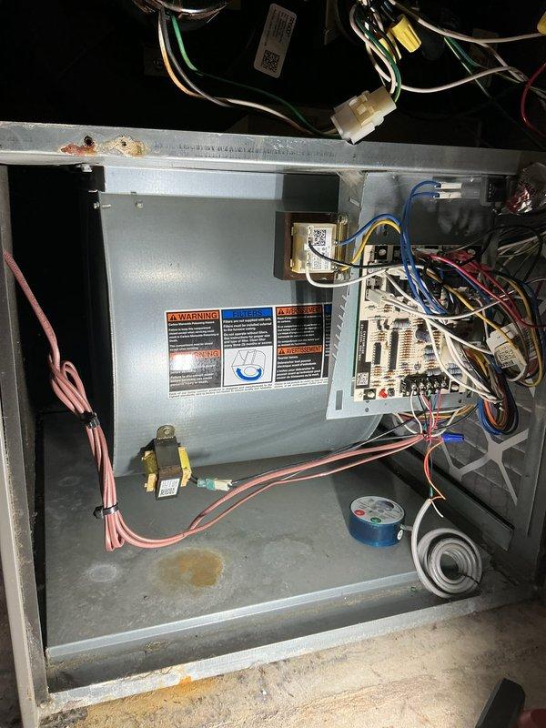 Completed comprehensive HVAC maintenance agreement inspection on Lennox air conditioning system. Customer reported rattling noise from unit, though system was operational at time of service. Performed thorough visual inspection of both indoor air handler cabinet and outdoor condensing unit. Indoor inspection revealed properly mounted control board with organized wiring harnesses, functional blower motor assembly, and all safety labels intact. Outdoor unit inspection showed Lennox condenser in good operating condition on stable concrete pad with adequate clearance from surrounding vegetation. All electrical connections secure, refrigerant lines properly insulated, and conduit properly mounted to building exterior. System tested and found operating within normal parameters. No rattling noise detected during service visit. Documented equipment condition with photographs for service records. Advised customer to monitor system and report if noise recurs for further diagnostic evaluation.