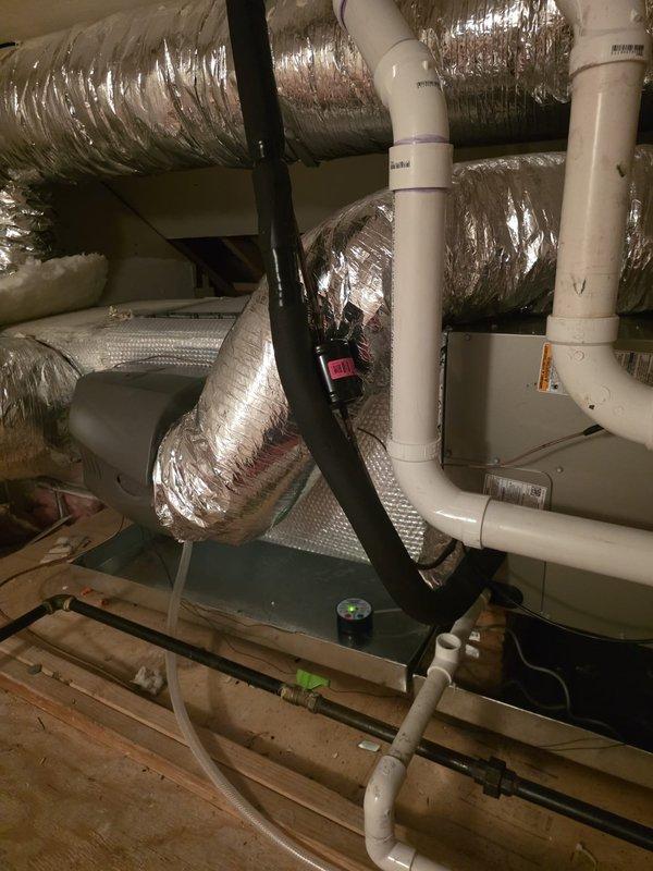 Responded to callback for plenum insulation near humidifier installation. Upon arrival, accessed attic space and located HVAC air handler and associated ductwork. Applied proper insulation to exposed plenum section adjacent to humidifier connection point to prevent condensation issues and improve system efficiency. Verified all ductwork connections remained secure and properly sealed. Documented completed work with photographs showing insulated plenum and surrounding HVAC components.