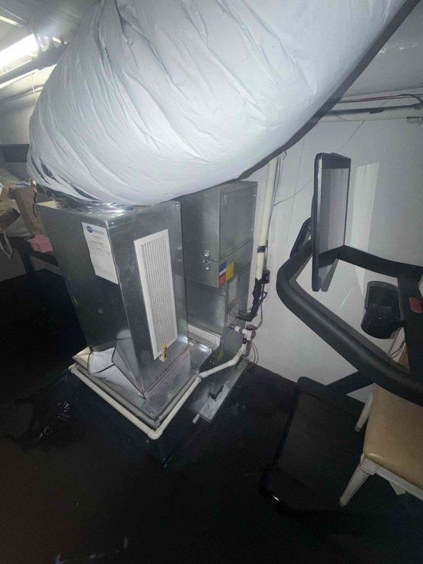 Performed comprehensive maintenance inspection on dual HVAC system consisting of two air handlers and two condensing units. Investigated reported issue of system shutting off and tripping breaker despite recent electrical rewiring by electrician. Conducted diagnostic testing including airflow measurements at supply registers and thorough visual inspection of both air handler units in attic mechanical space, checking electrical connections, refrigerant lines, condensate drainage, and all safety controls to identify source of electrical short occurring when system operates.