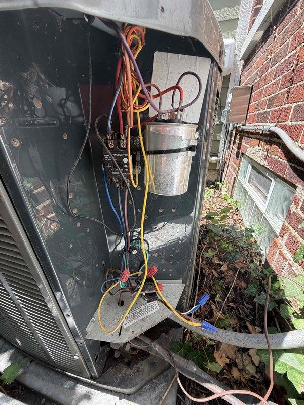 # HVAC Service Report

Responded to no cooling complaint on 8-year-old residential air conditioning system. Upon arrival, accessed outdoor condensing unit without ladder requirement. Removed service panel to inspect electrical components and capacitor assembly. Multiple wire connections were examined, including power and control wiring to compressor and fan motor circuits.

Investigation revealed significant moisture infiltration issue affecting system performance. Attic inspection documented extensive frost accumulation on roof decking underside, indicating severe condensation problems and inadequate ventilation. Flexible ductwork routing was assessed in relation to moisture concerns. The frost buildup pattern suggested ongoing temperature differential issues and insufficient attic insulation or air sealing.

Electrical connections at outdoor unit were inspected and found secure. Capacitor was tested and evaluated for proper microfarad ratings. System components showed normal weatheri