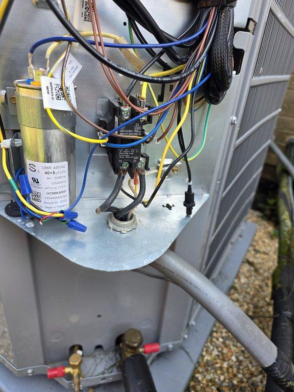 Responded to callback for recently installed 4-ton two-stage air conditioning system to address excessive noise, loose duct tape, and voltage drop causing lights to dim at startup. Inspected electrical connections, capacitor, and contactor assembly; secured all wiring and verified proper installation of components. Documented control board and electrical panel configuration with photos for quality assurance purposes.