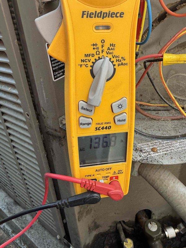 Completed comprehensive HVAC maintenance agreement service on condenser and air handler unit. Performed electrical diagnostics using clamp meter, recording voltage readings of 136.0V and amperage draw of 78.2A to verify proper system operation and component functionality. Conducted thorough system inspection, documented equipment conditions with photographic evidence, and confirmed unit operating within manufacturer specifications.