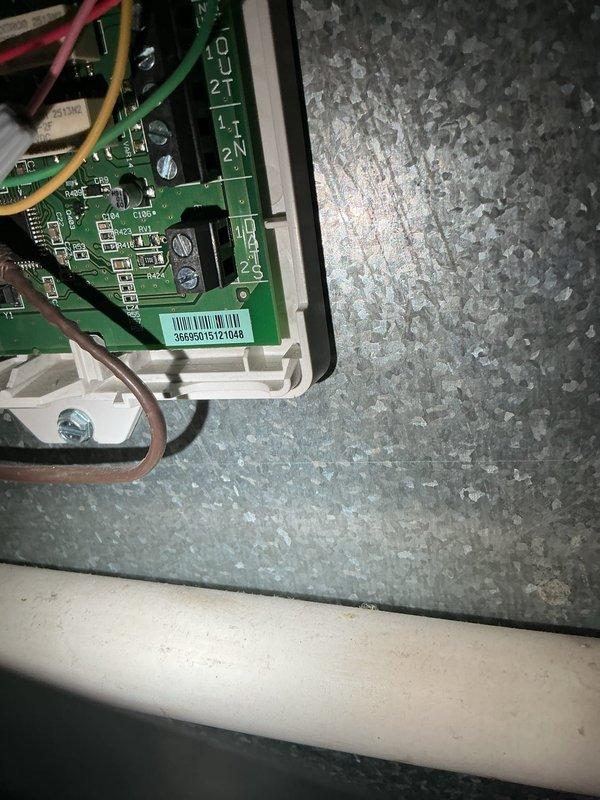 Responded to no cooling call following storm-related power outage. Upon inspection, determined that AC system failed to restart after electrical service was restored. Diagnosed failed control board due to power surge damage, evidenced by visual inspection of circuit board and system's complete failure to initialize. Documented existing control board configuration and wiring connections prior to replacement to ensure proper installation of new board.