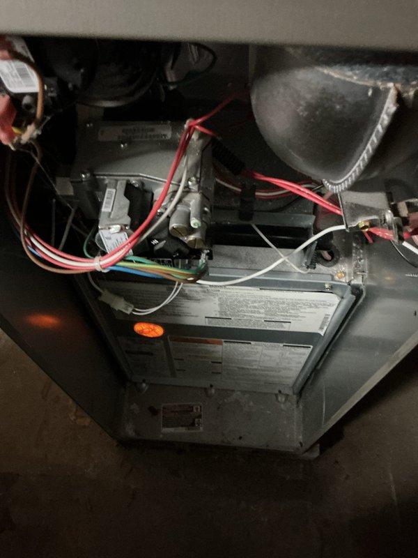 Responded to no cooling call following storm-related power outage. Upon inspection, determined that AC system failed to restart after electrical service was restored. Diagnosed failed control board due to power surge damage, evidenced by visual inspection of circuit board and system's complete failure to initialize. Documented existing control board configuration and wiring connections prior to replacement to ensure proper installation of new board.