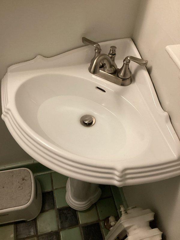 Responded to multiple drainage issues throughout the property. Cleared clogged first-floor corner-mounted bathroom sink with significant drainage problems, serviced additional clogged drains, cleaned outdoor drainage pipes connected to gutter system to restore proper water flow, and performed hydro-jetting on two sewer lines to remove blockages and buildup.