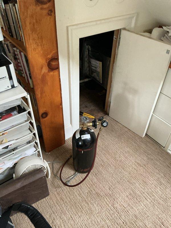 Responded to no cooling complaint for upstairs zone. Upon inspection, discovered condensate drain line blockage causing safety float switch activation, which shut down the air handler. Recovered refrigerant from system, cleared the clogged drain line, verified proper drainage flow, and tested float switch operation. Recharged system to manufacturer specifications, confirmed airflow restoration, and verified cooling operation resumed normally to upstairs areas.