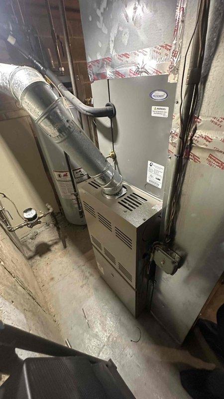 Completed comprehensive HVAC maintenance agreement inspection on residential heating and cooling system. Performed thorough visual examination of furnace unit, ductwork connections, and interior components including heat exchanger drum, capacitor assembly, electrical wiring, and blower motor housing. Documented equipment condition with photographic evidence showing normal operational wear patterns and minor dust accumulation in interior compartments.