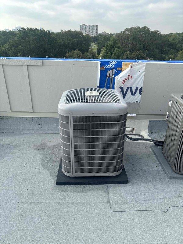 Provided remote quote for rooftop HVAC equipment replacement on commercial building. Assessed existing Lennox condenser units positioned on flat membrane roofing surface and documented current installation conditions including equipment placement, mounting pads, and rooftop access considerations for replacement work.