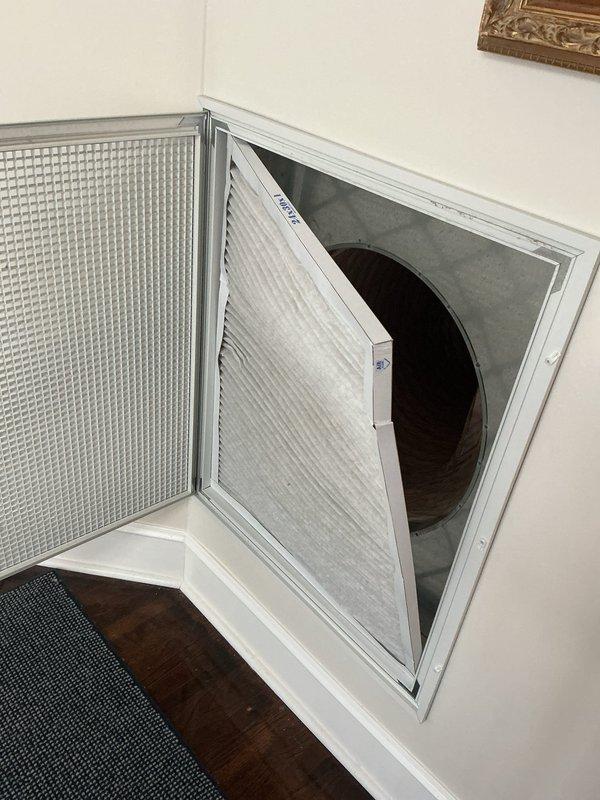 Completed preventive maintenance inspection on residential HVAC system including condenser unit and air handler. Accessed return air filter compartment through wall-mounted access panel, inspected filter condition, and verified proper airflow. Performed crawl space inspection of horizontal air handler unit, checked refrigerant lines, verified equipment operation, and documented system condition with photographic records per maintenance agreement requirements.