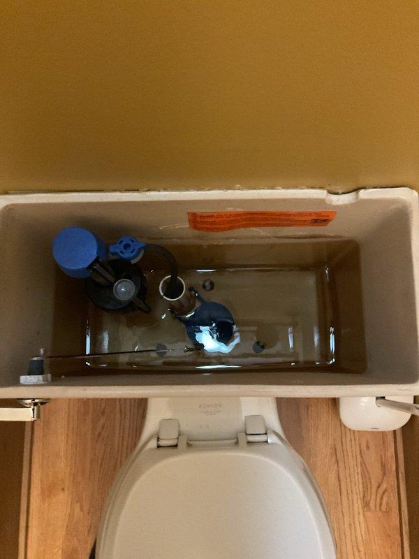 Responded to service call for slow-draining bathtub and potential toilet blockage. Inspected bathroom plumbing system including under-sink drainage assembly and toilet tank components. Assessed P-trap configuration and drainage pathways to identify obstruction points. Documented existing plumbing conditions and internal toilet tank mechanisms for service records.