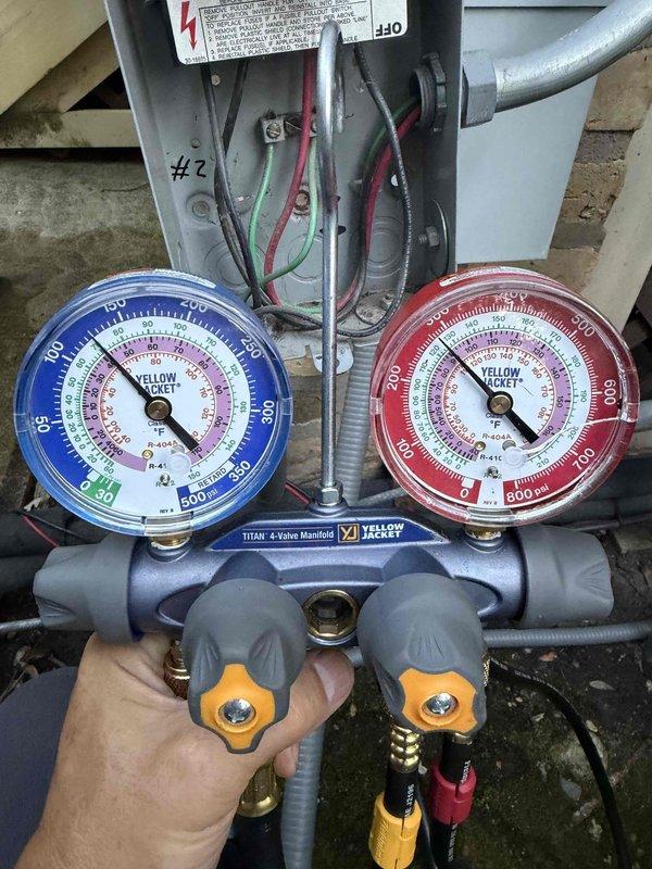 Responded to emergency no cooling call on Carrier air handler system located in attic space. Upon arrival, connected manifold gauges to assess refrigerant pressures and system operation. Diagnosed system issue and performed necessary service to restore cooling function.