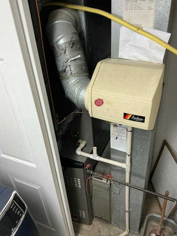 Completed comprehensive HVAC maintenance agreement service on residential forced-air heating system with integrated Aprilaire humidifier unit. Performed standard maintenance inspection of furnace/air handler, verified proper operation of humidity control system, checked condensate drainage piping and PVC connections, and conducted electrical testing of system components using diagnostic equipment. Installed 20x25x1 filter and inspected galvanized ductwork, gas line connections, and all mechanical components to ensure system operating within manufacturer specifications.