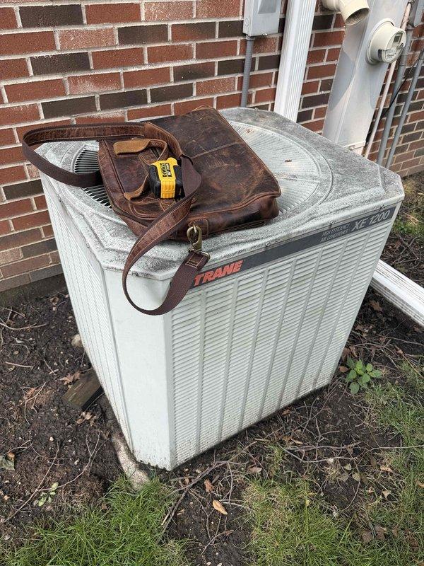 Completed full system HVAC estimate for replacement of non-functional air conditioning unit due to refrigerant leak. Assessed existing Trane condenser unit and attic-mounted furnace/air handler system with standard ductwork configuration, documenting equipment accessibility and installation requirements for complete system replacement.
