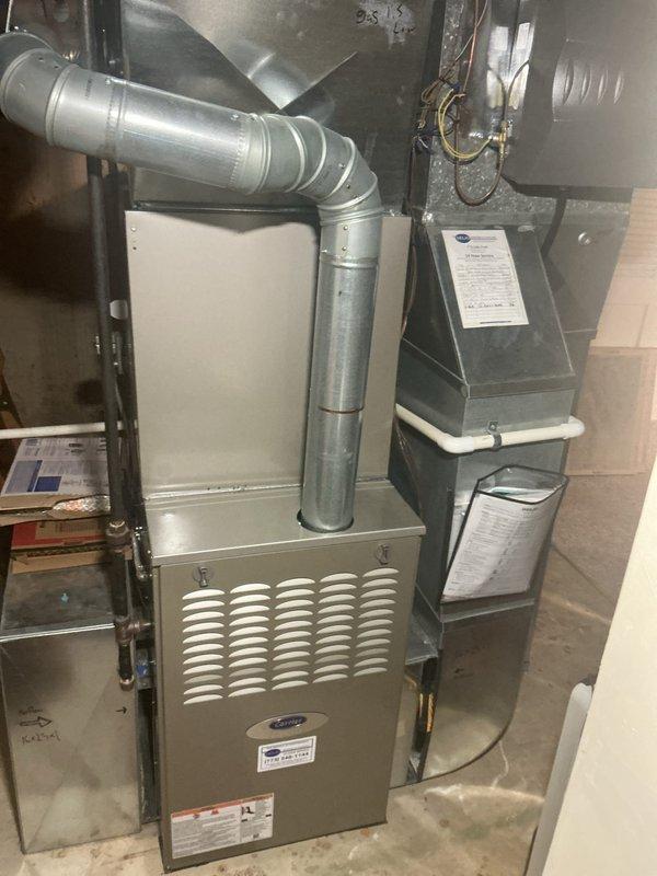 Completed comprehensive HVAC maintenance agreement inspection on residential split system including Carrier forced air furnace in basement and air handler unit in attic space. Performed visual inspection of all accessible components, verified proper operation of heating and cooling equipment, inspected ductwork connections and seals, checked electrical connections and disconnect switches, examined condensate drain lines with trap configuration for proper drainage, and documented system condition through photographic records for maintenance file.