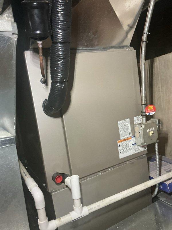 Completed comprehensive HVAC maintenance agreement inspection on residential split system including Carrier forced air furnace in basement and air handler unit in attic space. Performed visual inspection of all accessible components, verified proper operation of heating and cooling equipment, inspected ductwork connections and seals, checked electrical connections and disconnect switches, examined condensate drain lines with trap configuration for proper drainage, and documented system condition through photographic records for maintenance file.