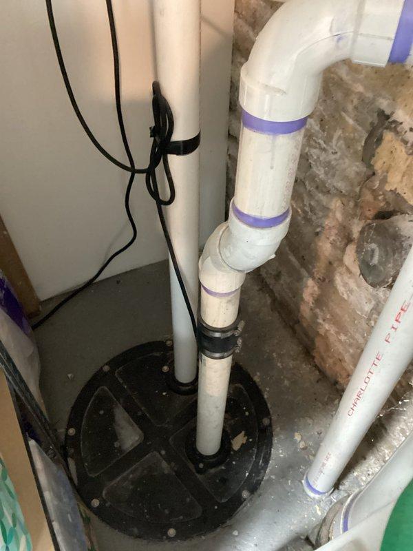 # Plumbing Inspection - Pipe Leak Investigation Near Boiler

Conducted comprehensive plumbing inspection with primary focus on reported pipe leak in vicinity of boiler system. Inspection revealed the leak originated from piping independent of the boiler unit itself, located in the mechanical room area.

## Work Performed

Performed thorough examination of all accessible plumbing systems throughout the property. Inspected basement mechanical room housing water heater, boiler unit, and associated piping infrastructure. Evaluated condition of copper supply lines, PVC drainage systems, and sump pump installation.

Identified leak source at pipe connection near but not integrated with the teal-colored boiler unit. Verified the compromised pipe was part of the general plumbing system rather than boiler-specific components. Assessed surrounding copper piping, insulated lines, and multiple valve assemblies for additional concerns.

Examined sump pump basin with multiple white PVC discharge pip