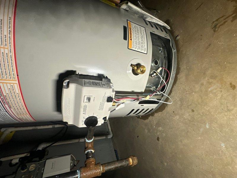 Responded to service call for water heater not functioning following flooding event. Upon arrival, found water heater with open access panel and visible internal components exposed. Inspection revealed significant water damage to unit and surrounding mechanical systems. Blower assembly exhibited extensive rust and corrosion throughout, indicating prolonged moisture exposure with heavy oxidation on interior surfaces and metal components. Assessed electrical connections and internal wiring for water damage and safety concerns. Documented equipment condition with photos showing corroded blower wheel, compromised internal components, and flood-related damage to mechanical systems. Provided customer with findings and recommendations for necessary repairs or replacement.