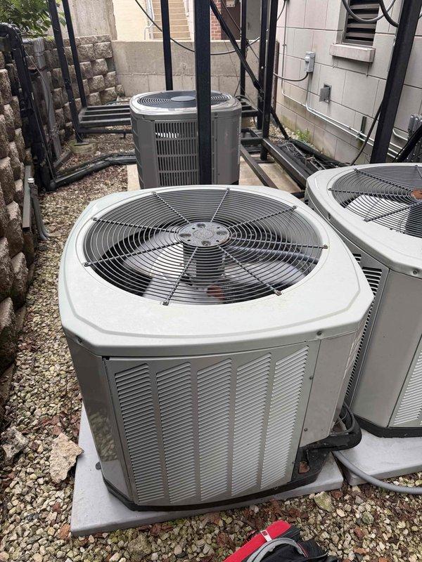 Completed comprehensive cooling and heating maintenance agreement service on residential HVAC system. Performed routine inspection of outdoor condenser units, verified proper operation of all equipment components, and documented existing conditions with photographic evidence. Inspected locking mechanism hardware and confirmed all units are functioning within normal parameters.