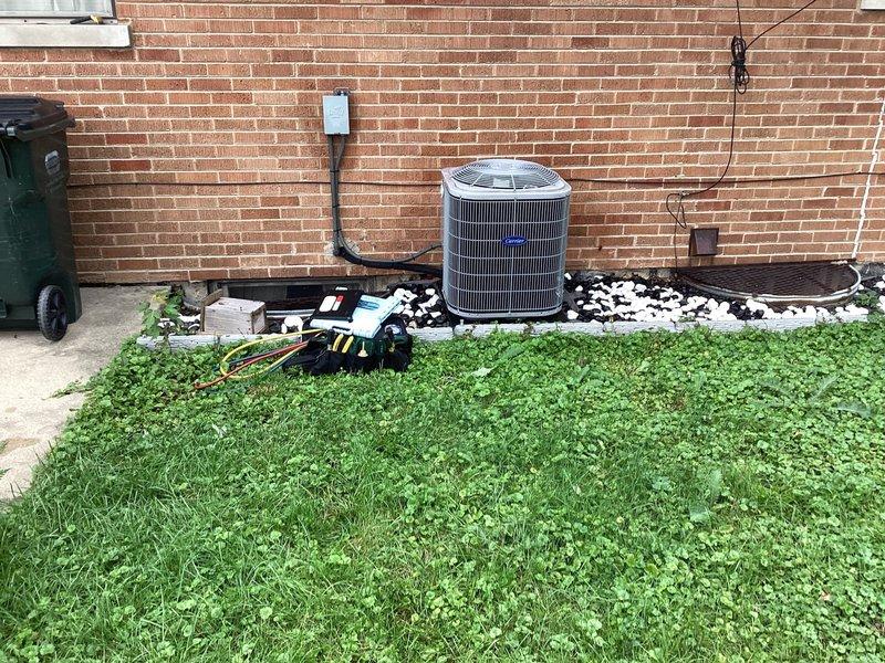 Completed comprehensive air conditioning maintenance agreement inspection on Carrier system. Performed full equipment evaluation including condenser coil inspection for cleanliness and leaks, blower motor and wheel debris check, indoor relative humidity testing, refrigerant level measurement, and cycling of operating controls. Inspected line voltage switch and wiring for safety, verified condensate system drainage, checked all electrical connections for tightness and deterioration, and examined refrigerant lines for visible leaks and insulation condition. System found in proper working order with all components functioning as designed.
