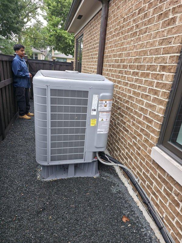 Responded to callback regarding recently installed condensing unit that appeared slightly slanted with potential fan interference. Upon arrival, performed thorough inspection of unit placement, leveling, and internal components. Verified unit is properly positioned on gravel pad with adequate clearance from structure and fence. Inspected fan assembly and determined no actual contact or rubbing present; unit operating within normal parameters. Documented installation with photos showing proper positioning, clearances, and equipment condition. No adjustments required.