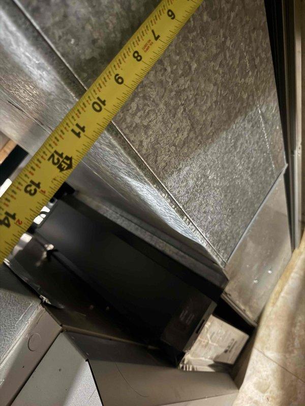 Conducted on-site evaluation for complete HVAC system replacement including air conditioning unit and furnace, both approximately 15 years old and nearing end of service life. Performed comprehensive assessment of existing ductwork system, measuring supply and return trunk lines to verify compatibility with proposed replacement equipment. Documented current system configuration including metal ductwork routing, elbow joints, and connection points in mechanical space. Evaluated outdoor equipment accessibility, confirming ground-level placement requiring no ladder work for installation access. Captured detailed measurements and photographic documentation of existing ductwork dimensions, seam construction, and mounting locations to ensure accurate equipment sizing and proper integration with current distribution system. Assessed mechanical room layout and clearance requirements for new equipment installation. Provided customer with replacement options and technical specifications based on