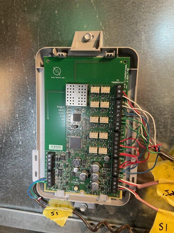 Responded to service call for Honeywell thermostat displaying system as running but not activating Carrier HVAC units. Inspected control board wiring and thermostat connections at terminal strip, verified proper wire terminations for heating and cooling circuits, and confirmed control board functionality. System restored to normal operation with thermostat properly communicating with HVAC equipment.