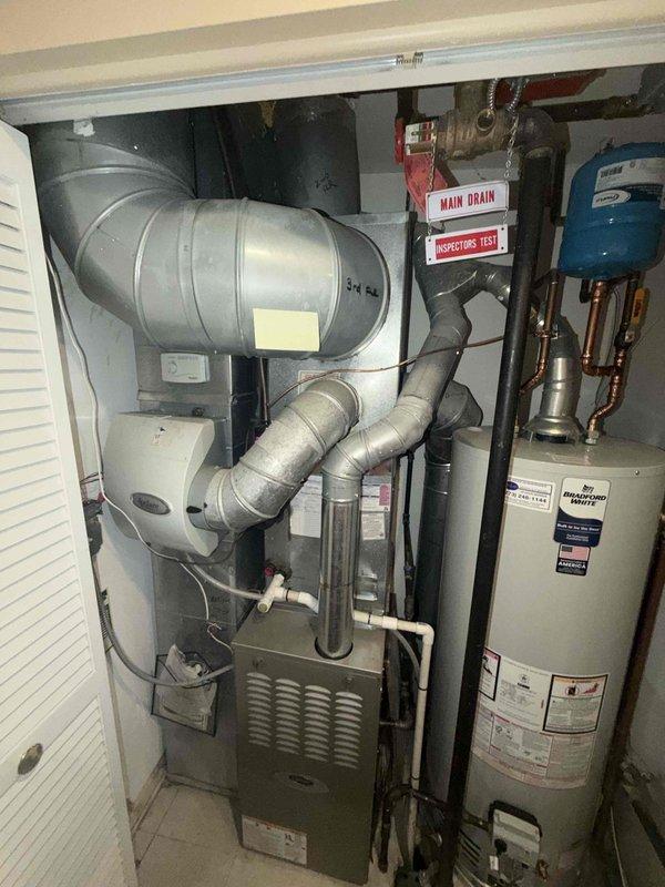 Completed scheduled HVAC maintenance agreement inspection on residential condensing unit and furnace system. Performed comprehensive visual inspection of outdoor condenser unit, examining electrical components including capacitor, contactor, and associated wiring connections for proper operation and signs of wear. Inspected indoor furnace unit located in utility closet alongside water heater, verified ductwork connections and system accessibility. All equipment found operating within normal parameters, no immediate repairs required at this time.